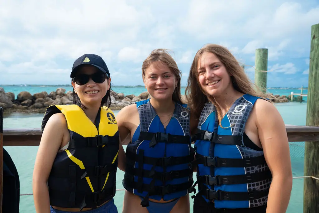Guests in life vests smiling on the dock before the nurse shark encounter