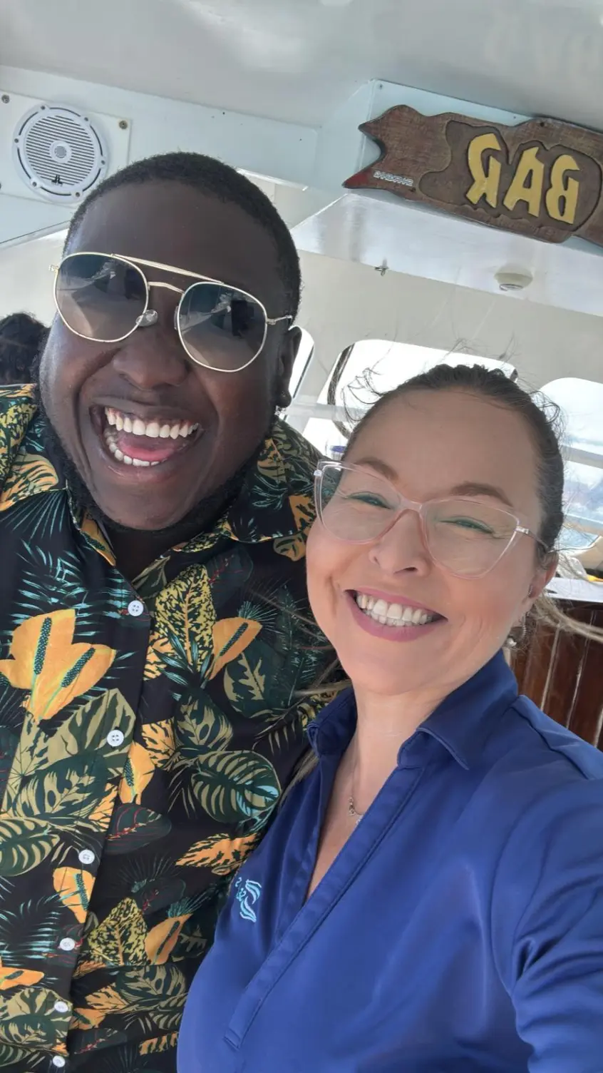 Seas N' Cays crew helping set up for a wedding celebration aboard the catamaran