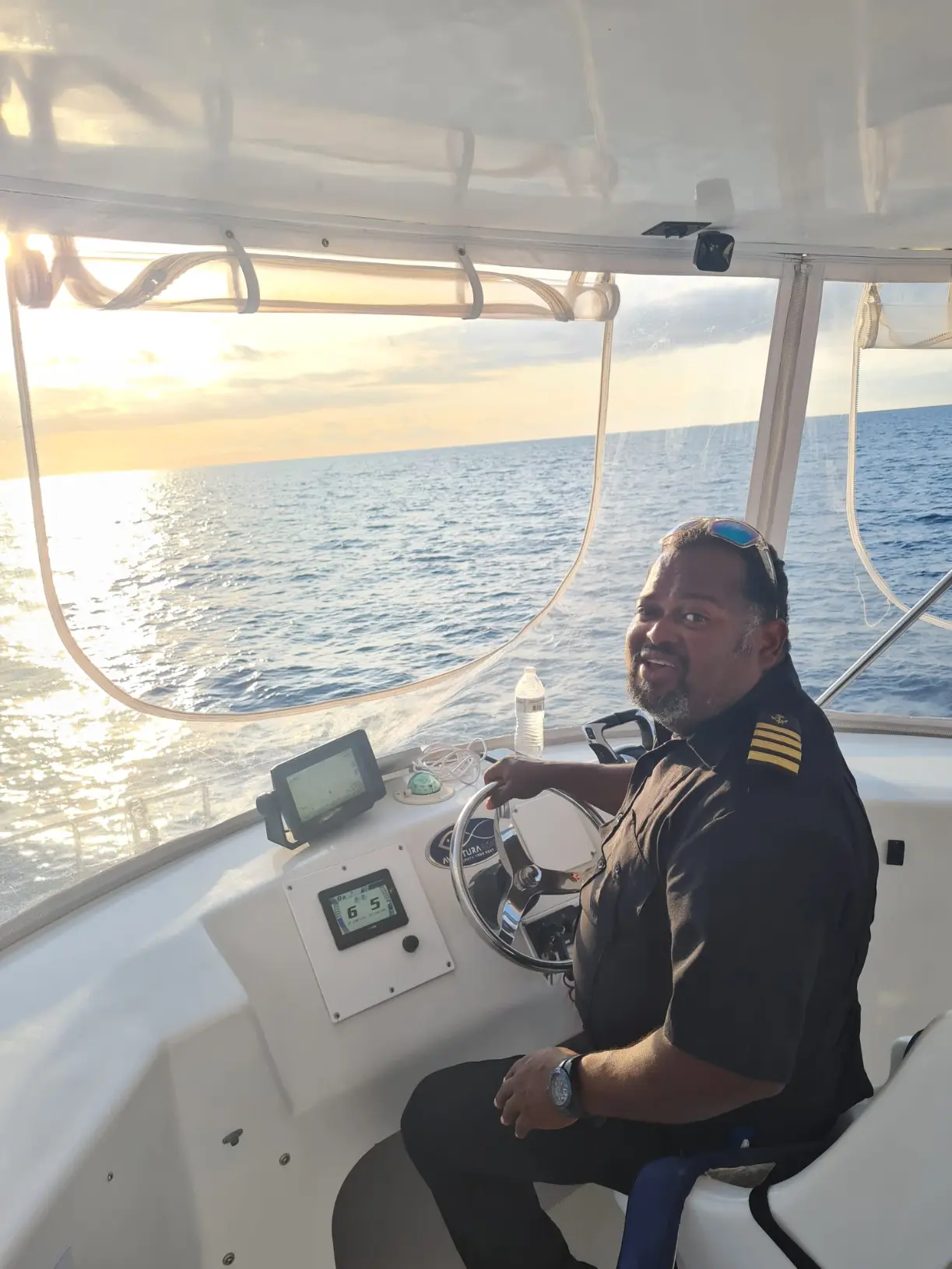 Seas N' Cays crew member preparing the deck before guests board in Nassau