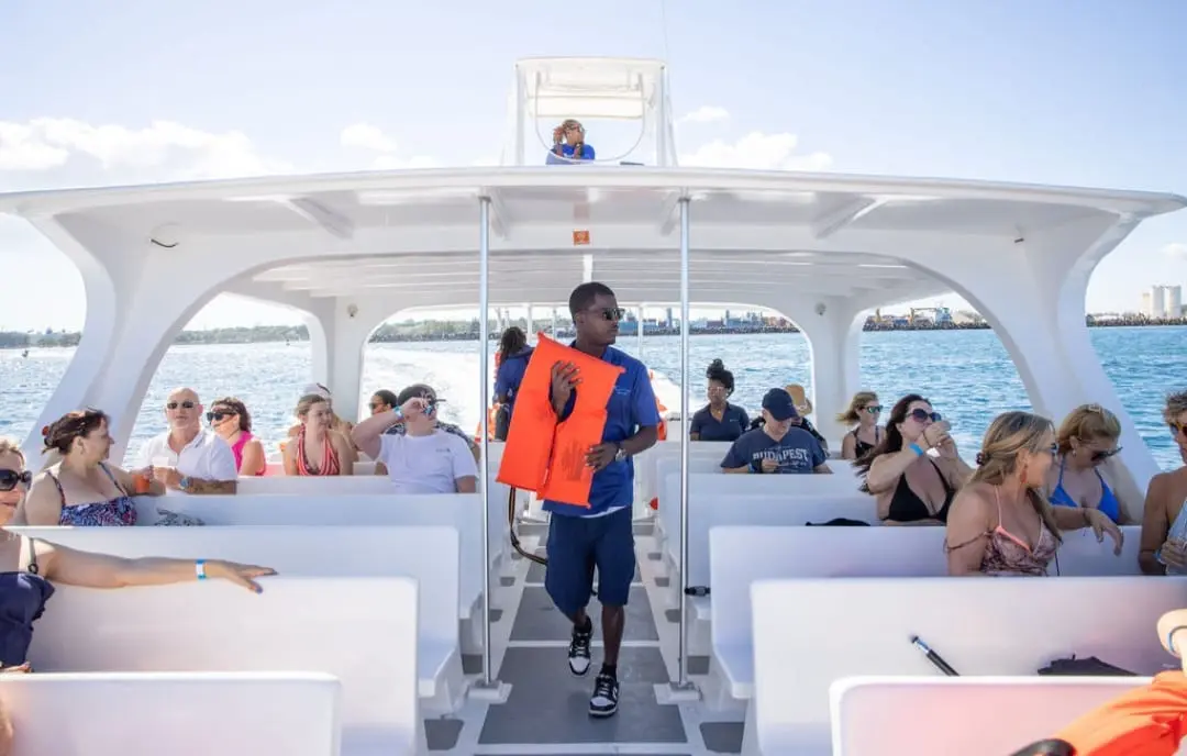 Seas N' Cays crew welcoming guests aboard the catamaran in Nassau for the Basic Package tour