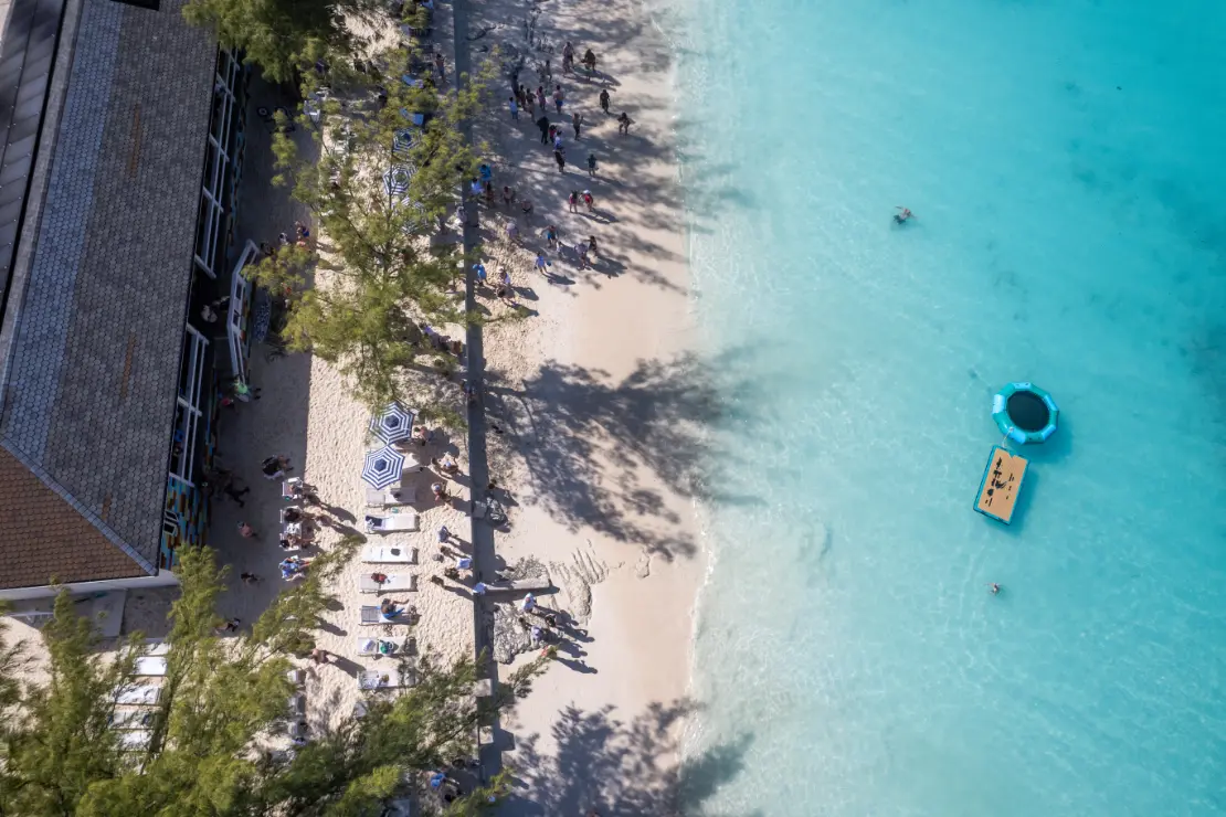 Empty white-sand beach on Rose Island used for private beach receptions