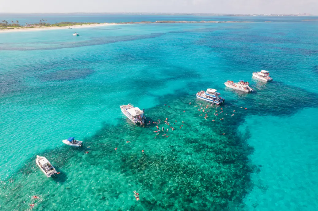 Open bow of the Seas N' Cays catamaran with guests enjoying the Bahamian breeze